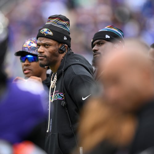 Baltimore Ravens quarterback Lamar Jackson looks on from the sidelines during the first half of an NFL football game against the Los Angeles Rams Sunday, Oct. 12, 2025, in Baltimore. (AP Photo/Nick Wass)
