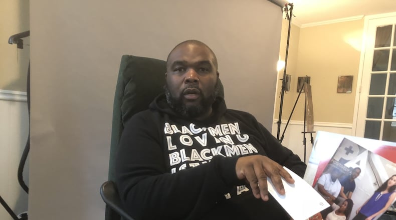 Johnnie Ray Kornegay III talks about his efforts to tell the stories of black gay men at his photography studio in Stone Mountain. GRACIE BONDS STAPLES / GSTAPLES@AJC.COM