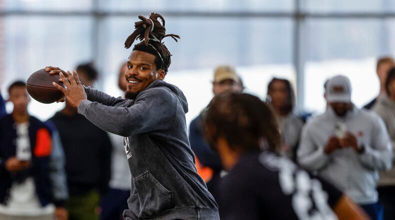 Former NFL and Auburn quarterback, Cam Newton, throws a pass during Auburn Pro Day, Tuesday, March 21, 2023, in Auburn, Ala. (AP Photo/Butch Dill)