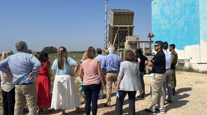 An Israeli soldier briefs Gov. Brian Kemp and members of the Georgia delegation on Israel's antimissile Iron Dome system.