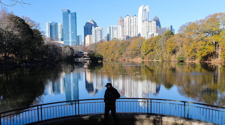 Mason Voudrie takes in the first day of winter at Piedmont Park Wednesday. JOHN SPINK / JSPINK@AJC.COM