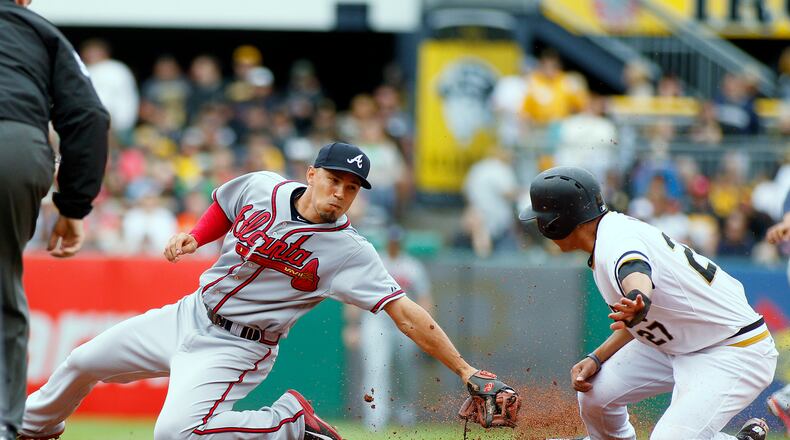 PITTSBURGH, PA - JUNE 28: Jung Ho Kang #27 of the Pittsburgh Pirates steals second base in the first inning against Andrelton Simmons #19 of the Atlanta Braves during the game at PNC Park on June 28, 2015 in Pittsburgh, Pennsylvania. (Photo by Justin K. Aller/Getty Images)