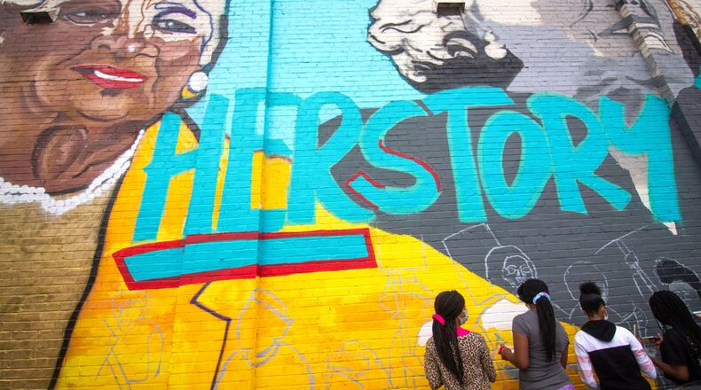 The mural, “Heroine: Unsung Women Involved in Civil and Social Justice,” covers the east side of the West End Goodwill store. STEVE SCHAEFER / FOR THE AJC
