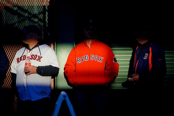 FILE-Fans arrive at Fenway Park in this Oct. 19, 2021, file photo in Boston.(AP Photo/Robert F. Bukaty, files)