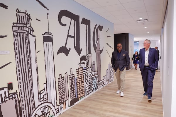Atlanta Journal-Constitution editor-in-chief Leroy Chapman gives Delta Air Lines CEO Ed Bastian a tour of AJC newsroom before meeting with the editorial board on Wednesday, Aug. 13, 2025. (Natrice Miller/AJC)