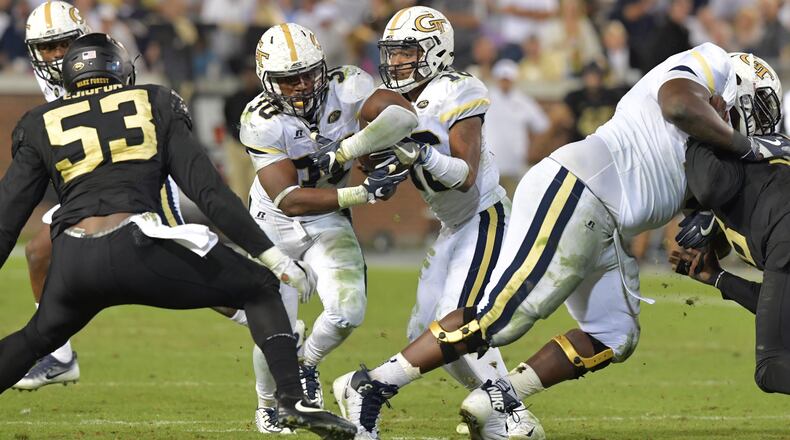 October 21, 2017 Atlanta - Georgia Tech quarterback TaQuon Marshall (16) fakes hand-off to Georgia Tech running back KirVonte Benson (30) in the second half of an NCAA college football game at Bobby Dodd Stadium on Saturday, October 21, 2017. Georgia Tech beat Wake Forest 38-24. HYOSUB SHIN / HSHIN@AJC.COM