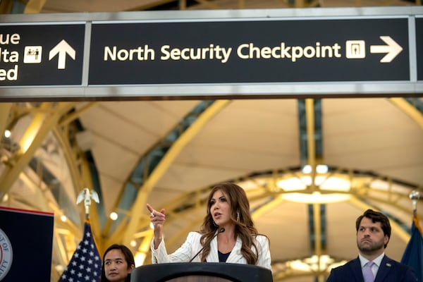 Homeland Security Secretary Kristi Noem announces that most airline passengers will no longer have to remove their shoes at security checkpoints on Tuesday, July 8, 2025, during a news conference at Reagan Washington National Airport. (Mark Schiefelbein/AP)