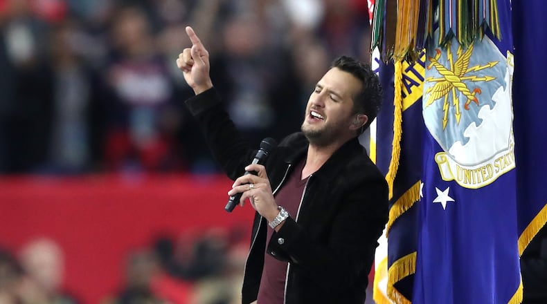 HOUSTON, TX - FEBRUARY 05: Luke Bryan sings the National Anthem prior to Super Bowl 51 between the New England Patriots and the Atlanta Falcons at NRG Stadium on February 5, 2017 in Houston, Texas. (Photo by Elsa/Getty Images)