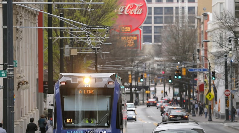 The Atlanta Streetcar makes its way up Peachtree Street. BOB ANDRES /BANDRES@AJC.COM