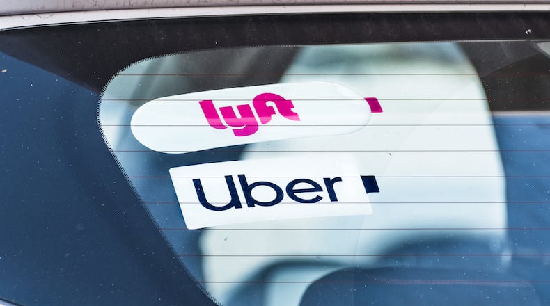 Uber Technologies Inc. has begun locking New York City drivers out of its app during periods of low demand in an attempt to fight a minimum wage rule, and Lyft Inc. is threatening to do the same. (Dreamstime/TNS)