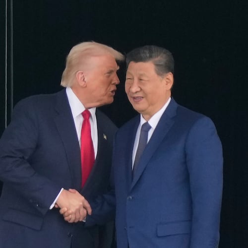 President Donald Trump, left, and Chinese President Xi Jinping, right, shake hands after their U.S.-China summit meeting at Gimhae International Airport Jinping in Busan, South Korea, Thursday, Oct. 30, 2025. (AP Photo/Mark Schiefelbein)
