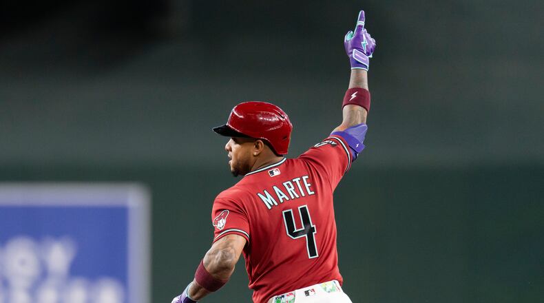 Arizona Diamondbacks' Ketel Marte (4) gestures after hitting the game-winning home run in the 10th inning of a baseball game against the Atlanta Braves, Sunday, April 5, 2026, in Phoenix. (AP Photo/Rebecca Noble)