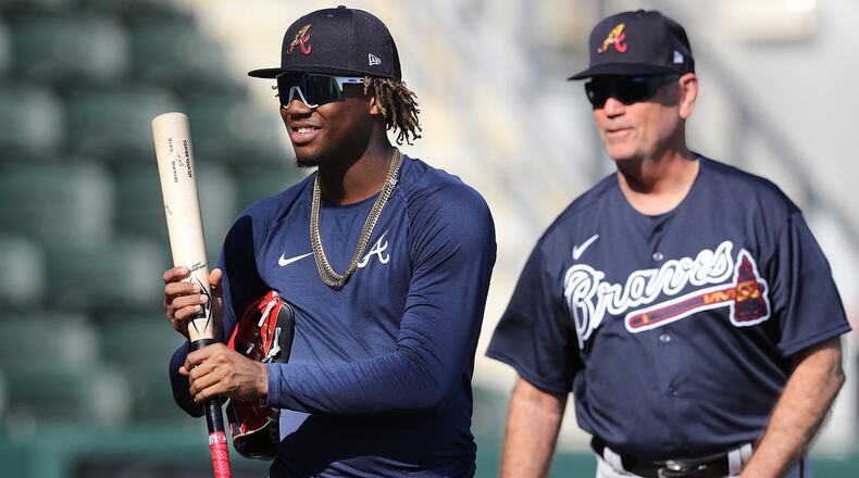 Braves manager Brian Snitker looks on while Ronald Acuna Jr. takes batting practice in CoolToday Park at spring training on Saturday, Feb. 15, 2020, in North Port.  Curtis Compton ccompton@ajc.com