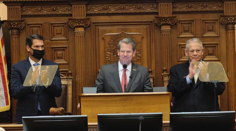 Gov. Brian Kemp, with Lt. Gov. Geoff Duncan (left) and House Speaker David Ralston (right), speaks during the State of the State on Thursday, Jan. 13, 2022, in Atlanta. Kemp backs legislation that would let parents opt their children out of masks in Georgia school districts that require them. Senate Bill 514 advanced out of the state Senate on Tuesday, March 1, 2022. (Ben Gray for The Atlanta Journal-Constitution)