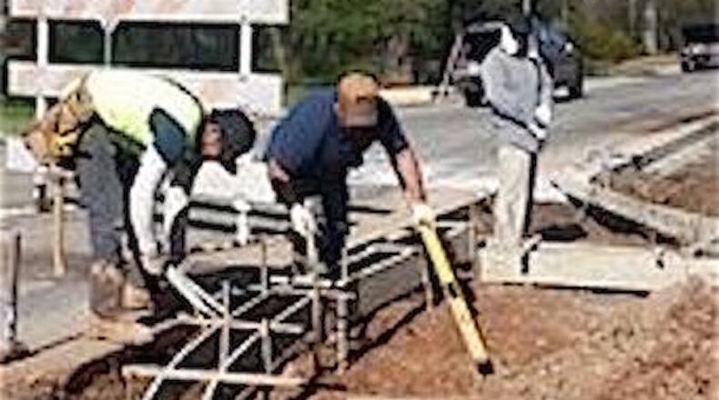 Sidewalk construction begins along Buford Highway from Jimmy Carter to Beaver Ruin in Norcross. Courtesy of city of Lilburn