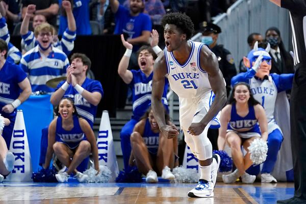 Duke forward AJ Griffin (21) celebrates after shooting a three point basket against Arkansas during the second half of a college basketball game in the Elite 8 round of the NCAA men's tournament in San Francisco, Saturday, March 26, 2022. (AP Photo/Marcio Jose Sanchez)