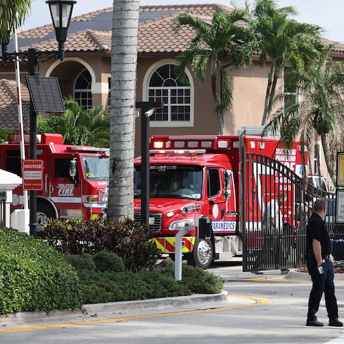 Emergency personnel from Coral Springs and Coconut Creek are on scene where a plane crashed in the Windsor Bay community in Coral Springs on Monday, Nov. 10, 2025. (Carline Jean/South Florida Sun-Sentinel via AP)