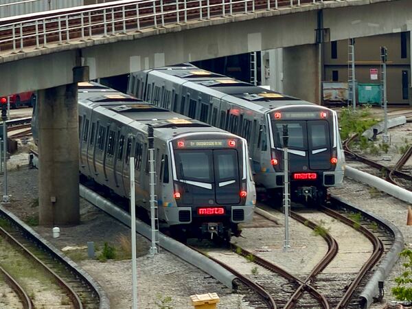 Two of the new CQ400 railcars are parked at Avondale Yard on May 29, 2026. As the World Cup approaches, new MARTA trains have not yet completed essential safety tests and won’t be ready, and MARTA has canceled the planned launch of its new railcars. (Miguel Martinez/AJC)