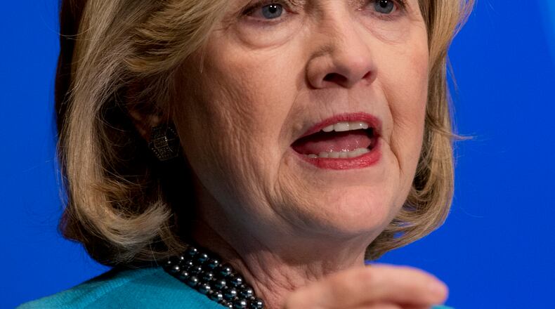 Former Secretary of State Hillary Rodham Clinton speaks in Gaston Hall at Georgetown University, in Washington, Wednesday, Dec. 3, 2014, about Smart Power: Security Through Inclusive Leadership as part of the launch of the inaugural National Action Plan Academy, a joint initiative of the Georgetown Institute for Women, Peace and Security, The Institute for Inclusive Security and the No Ceilings initiative of the Clinton Foundation. (AP Photo/Carolyn Kaster) AP Photo/Carolyn Kaster