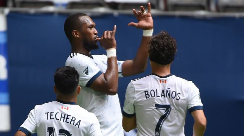 Jun 3, 2017; Vancouver, British Columbia, CAN; Vancouver Whitecaps defender Kendall Waston (4) celebrates his goal against Atlanta United goalkeeper Alec Kann (not pictured) during the first half at BC Place. Mandatory Credit: Anne-Marie Sorvin-USA TODAY Sports