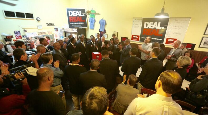 Gov. Nathan Deal stumps with black preachers at an event in McDonough.