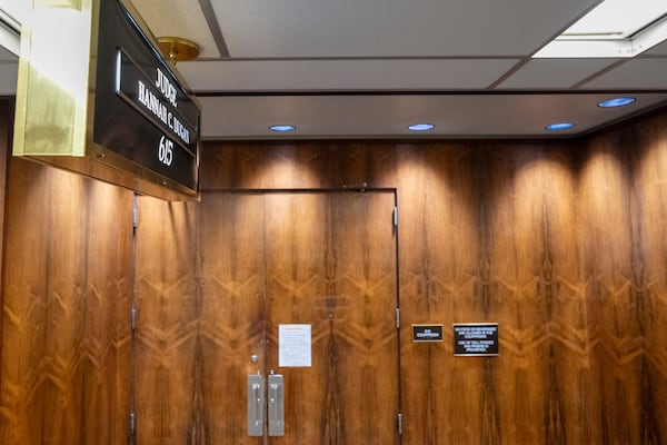 A sign is posted on the doors of Judge Hannah Dugan courtroom Friday, April 25, 2025, in Milwaukee. (AP Photo/Andy Manis)