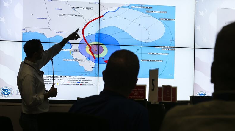 The Federal Emergency Management Agency (FEMA) Regional Response Coordination Center in DeKalb County monitored Hurricane Matthew’s progress on Friday, Oct. 7, 2016. JOHN SPINK /JSPINK@AJC.COM