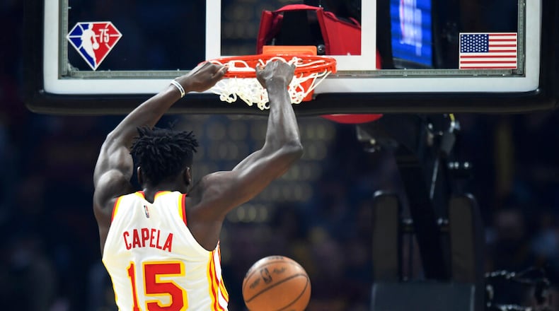Atlanta Hawks' Clint Capela dunks during the first half of the team's NBA play-in basketball game against the Cleveland Cavaliers Friday, April 15, 2022, in Cleveland. (AP Photo/Nick Cammett)