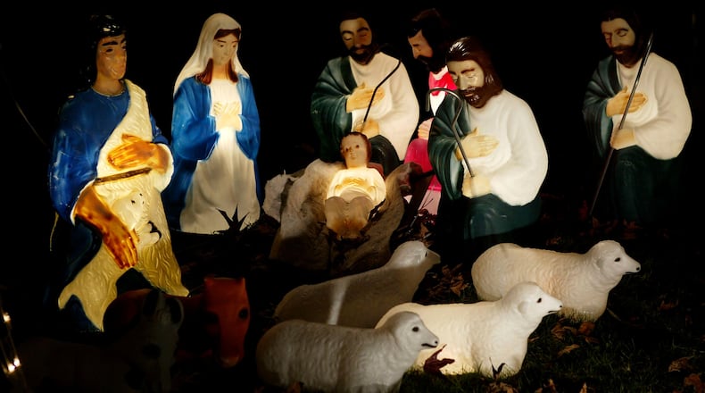 A life-size nativity scene glows in a yard in Pasadena, California.