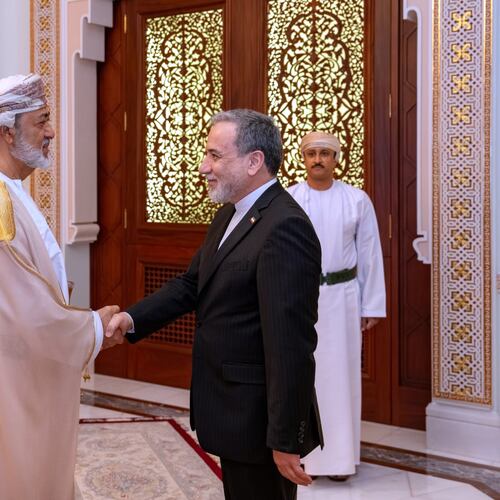 In this photo released by the Iranian Foreign Ministry, Iranian Foreign Minister Abbas Araghchi, right, shakes hands with Oman's Sultan Haitham bin Tariq during their meeting, in Muscat, Oman, Sunday, April 26, 2026. (Iranian Foreign Ministry via AP)