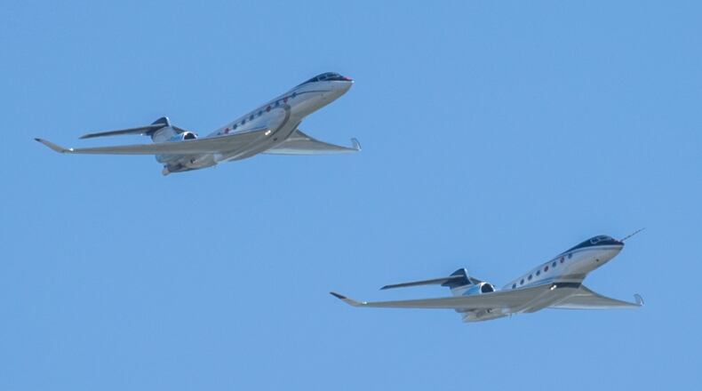 The G700 (top) and G800 (bottom) perform a fly-over during an event to celebrate the newly certified Gulfstream Aerospace Corporation G700 in Savannah. (Stephen B. Morton/AJC 2024)