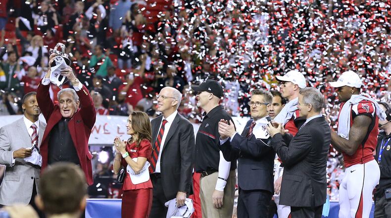 The Falcons are trying to get back to the Super Bowl after losing in the second round of the playoffs last season at Philadelphia. Here, owner Arthur Blank lifts the NFC championship trophy after a win over Green Bay two seasons ago