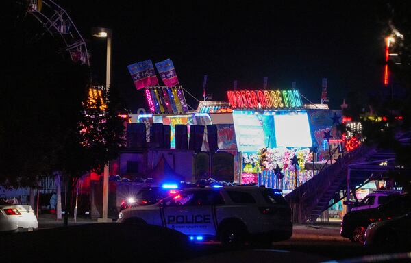 Law enforcement investigate after a reported shooting at WestFest in West Valley City, Utah, June 15, 2025. (Chris Samuels/The Salt Lake Tribune via AP) **NOT AN AP MEMBER**