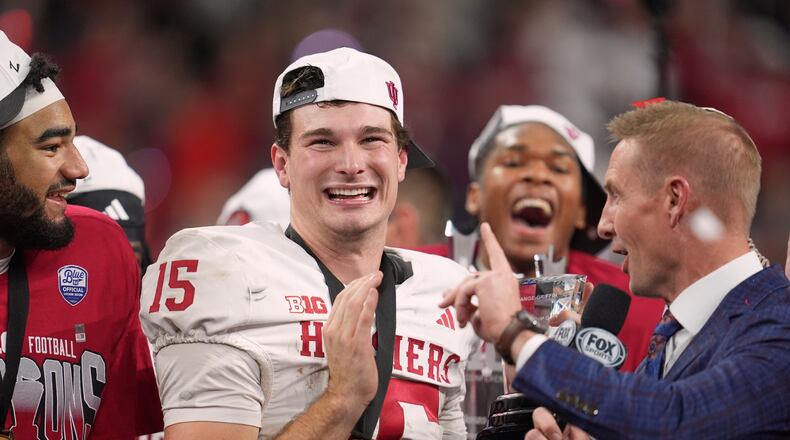 Indiana's Fernando Mendoza celebrates after after the Big Ten championship NCAA college football game against Ohio State in Indianapolis, Saturday, Dec. 6, 2025. (AP Photo/Michael Conroy)