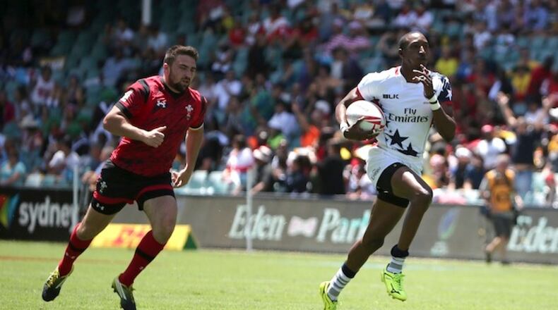 Perry Baker of U.S. right, breaks aways to score a try during the World Rugby 7's Series match against Wales in Sydney, Australia, Saturday, Feb. 6, 2016.(AP Photo/Rob Griffith)
