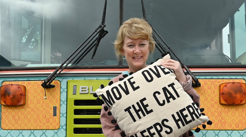 March 26, 2020 Marietta - Portrait of Molly Holm, the owner of Glory Haus, with their pillows at Glory Haus in Marietta on Thursday, March 26, 2020. Glory Haus, a Cobb County-based home decor business, suffered a massive slump in order cancellations from companies that sell their products due to the novel coronavirus. The business on Monday was featured on Good Morning America’s Deals & Steals from small businesses segments. Since then, the business has seen a sudden, drastic turnaround. Since Monday’s segment, it has received 10,000 orders for its products. (Hyosub Shin / Hyosub.Shin@ajc.com)