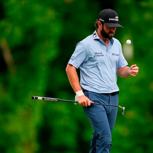 Cameron Young flips his golf ball on the 12th green during third round of the Truist Championship golf tournament at the Quail Hollow Club, Saturday, May 9, 2026, in Charlotte, N.C. (AP Photo/Chris Carlson)