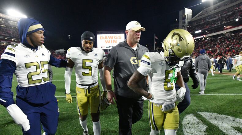 Georgia Tech head coach Brent Key and players leave the football field after Georgia won 44-42 over Georgia Tech in eight overtimes during an NCAA football game at Sanford Stadium, Friday, November 29, 2024, in Athens. (Hyosub Shin / AJC)