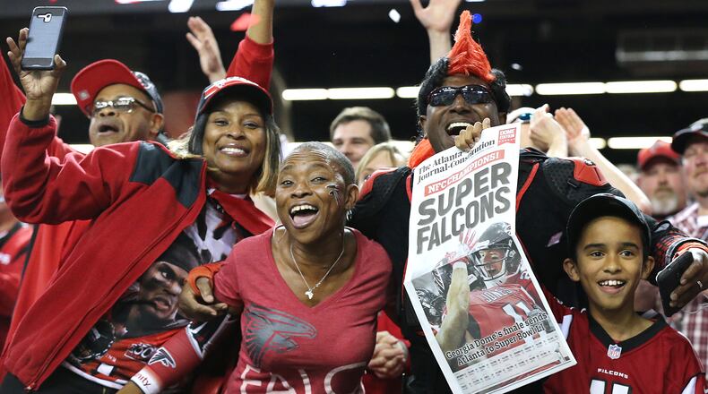 Ah, those were the days: Falcons fans celebrate last season's NFC Championship victory over Green Bay, and an upcoming trip to the Super Bowl. (Curtis Compton/ccompton@ajc.com)