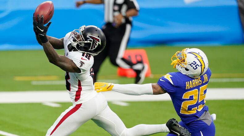 Atlanta Falcons wide receiver Calvin Ridley (18) catches a touchdown pass from wide receiver Russell Gage in front of Los Angeles Chargers cornerback Chris Harris Jr. during the first half Sunday, Dec. 13, 2020, in Inglewood, Calif. (Ashley Landis/AP)
