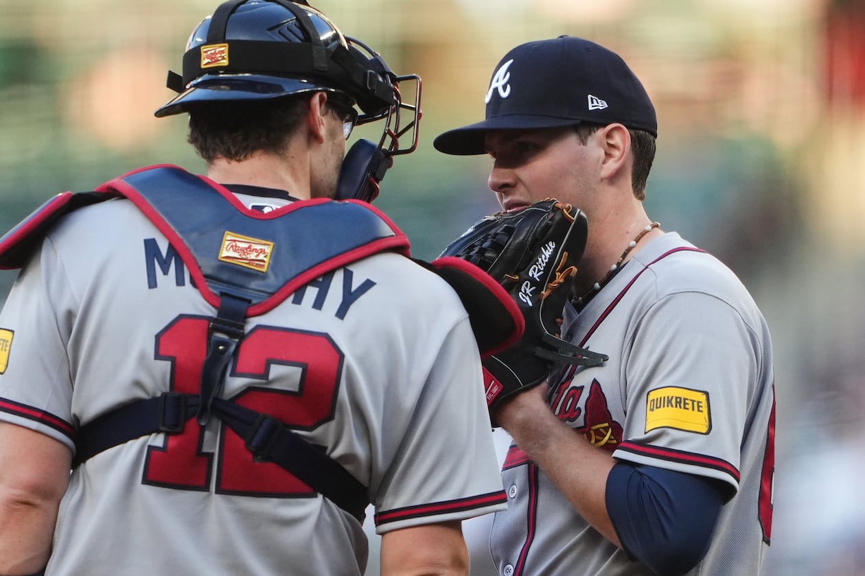 Atlanta Braves catcher Sean Murphy (12) talks with starting pitcher JR Ritchie on the mound during the second inning of a baseball game against the Seattle Mariners, Monday, May 4, 2026, in Seattle. (AP Photo/Lindsey Wasson)