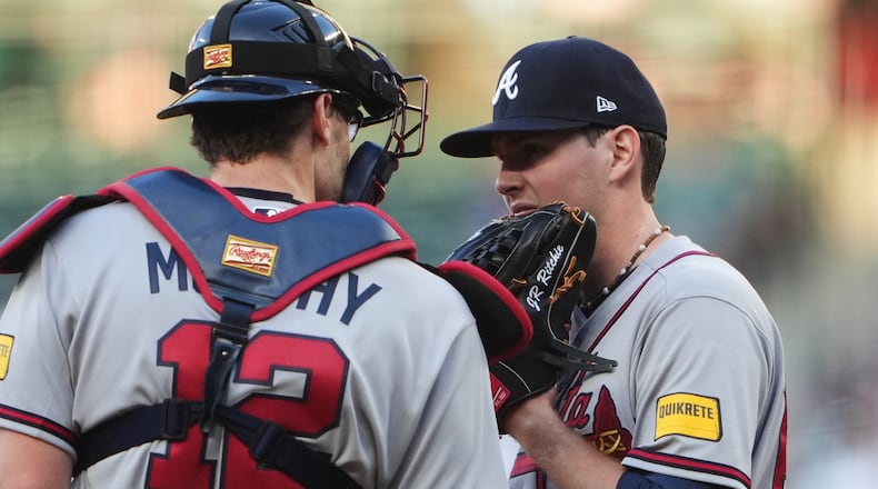 Atlanta Braves catcher Sean Murphy (12) talks with starting pitcher JR Ritchie on the mound during the second inning of a baseball game against the Seattle Mariners, Monday, May 4, 2026, in Seattle. (AP Photo/Lindsey Wasson)