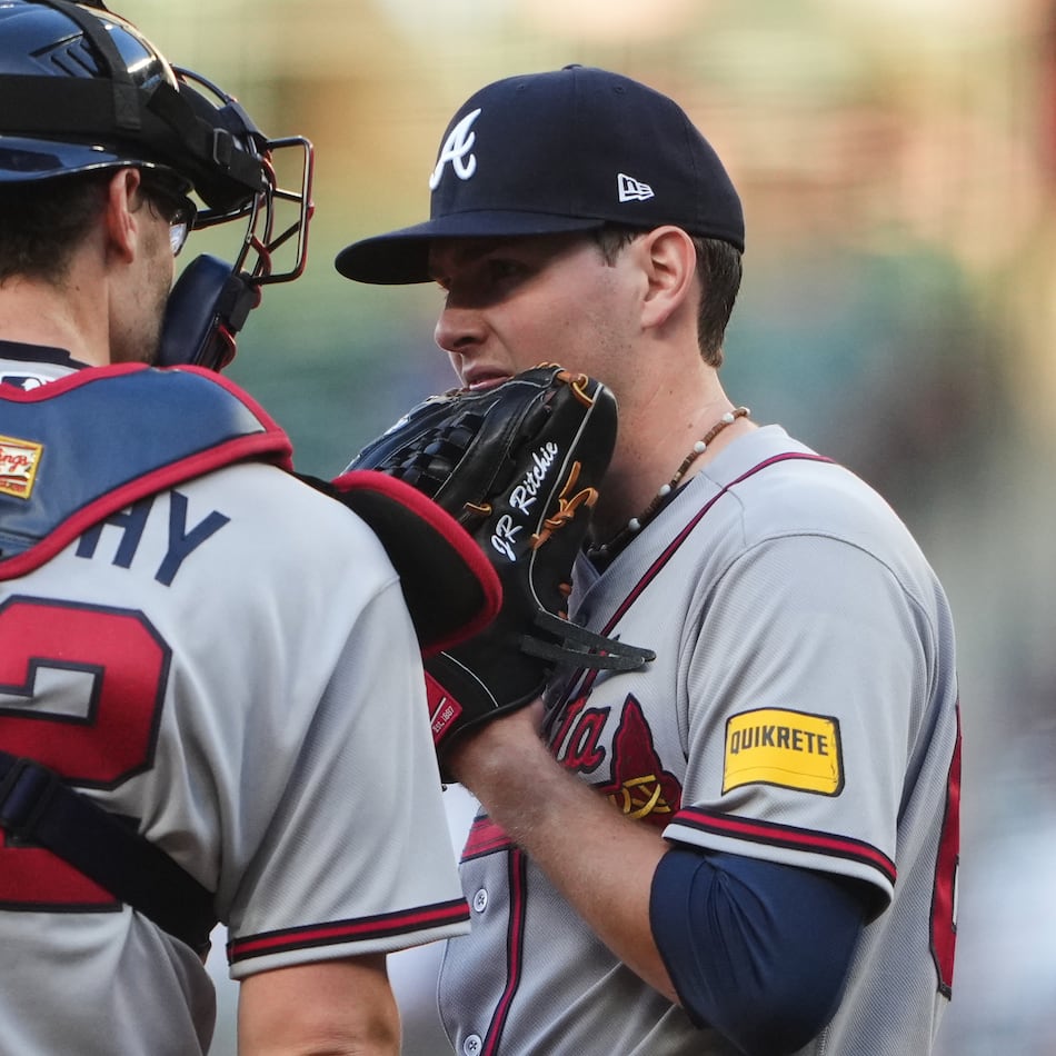 Braves catcher Sean Murphy (12) talks with starting pitcher JR Ritchie on the mound during the second inning against the Mariners on Monday, May 4, 2026, in Seattle. (Lindsey Wasson/AP)