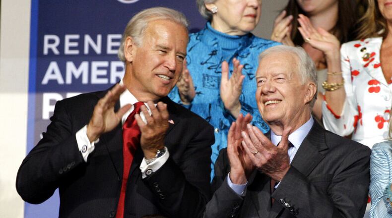 Former President Jimmy Carter (right) is seen with Democratic vice presidential candidate Sen. Joe Biden, D-Delaware, at the Democratic National Convention in Denver, Tuesday, Aug. 26, 2008. (AP Photo/Paul Sancya)