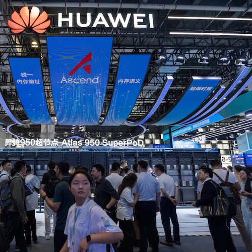 Visitors past by the Huawei booth display of the Atlas 950 SuperPoD during the World AI Conference in Shanghai, China on Friday, July 17, 2026. (AP Photo/Ng Han Guan)