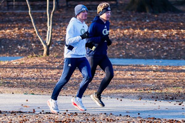 Georgia Tech students run in Piedmont Park in Atlanta on Thursday, Jan. 15, 2026. Metro area temperatures are in the 20s and 30s as the sun rises with additional wind gusts up to 30 mph. (Abbey Cutrer/AJC)