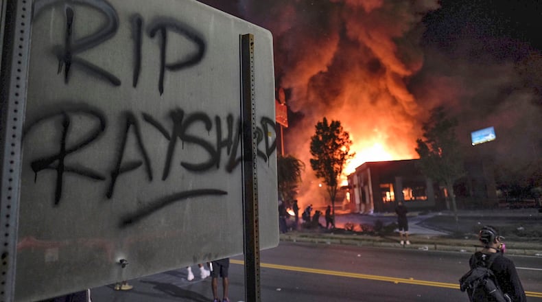 Wendy's  isin flames affter demonstrators blocked the interstate and set the restaurant on fire on Saturday evening, June 13, 2020. Protesters gathered at University Avenue at the Atlanta Wendy's where Rayshard Brooks, a 27-year-old Black man,  was shot and killed by Atlanta police Friday evening. (Photo: Ben Gray for The Atlanta Journal-Constitution)