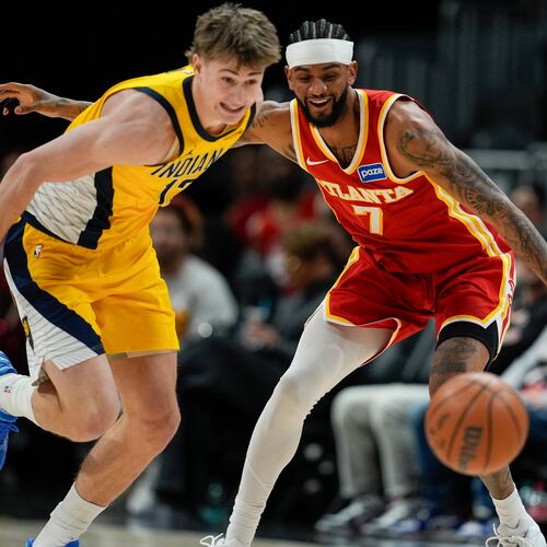 Pacers guard Johnny Furphy (left) and Hawks guard Nickeil Alexander-Walker chase a loose ball during the first half Monday, Jan. 26, 2026, in Atlanta. (Mike Stewart/AP)