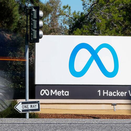FILE - A car passes Facebook's new Meta logo on a sign at the company headquarters on Oct. 28, 2021, in Menlo Park, Calif. (AP Photo/Tony Avelar, File)