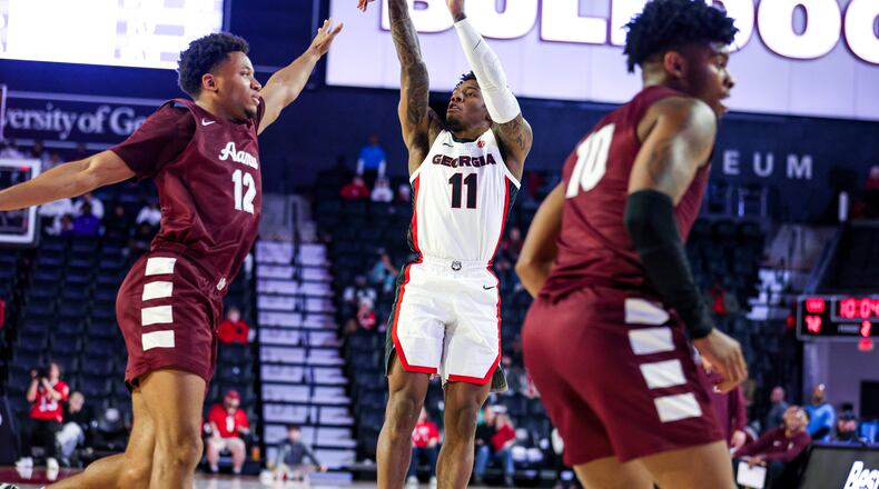Georgia guard Justin Hill (11) takes a shot during Georgia’s game against Alabama A&M on Dec. 30, 2023. The senior guard had the hot hand for the Bulldogs again Wednesday night against Araknsas (Olivia Wilson/UGAAA)